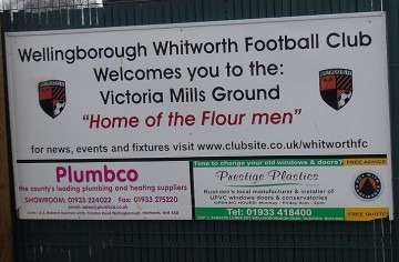 1280px-Wellingborough_whitworth_fc_welcome_car_park_signage